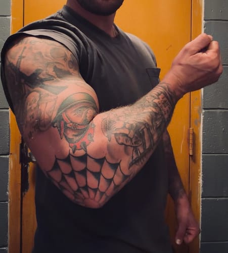 Reviewer showing their muscular arm, highlighting results from using the Primal Testosterone Booster.