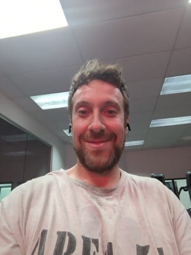 Reviewer's sweaty, smiling selfie at the gym while using the Ancestral Testosterone Booster.